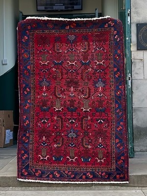 Lot 916 - A 20th century Persian rug, the rectangular...