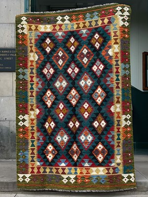 Lot 919 - A 20th century Maimana Kilim rug, worked in...