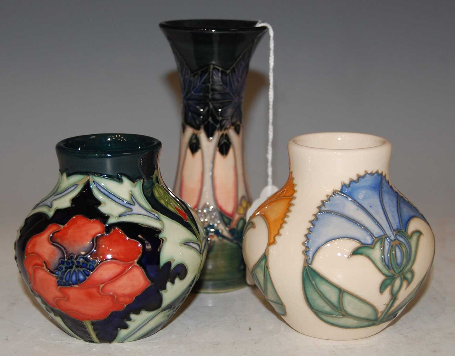 Lot 204 - Three Moorcroft pottery vases to include a...