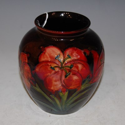 Lot 207 - A Moorcroft pottery flambé ground vase,...