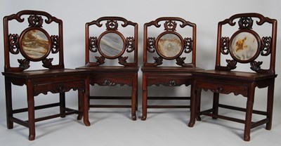 Lot 29 - A set of four Chinese darkwood chairs, late...