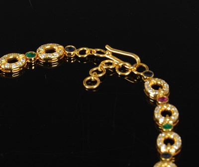 Lot 460 - A yellow metal, diamond, emerald, ruby and...