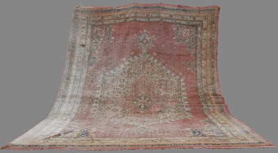 Lot 149 - A large Ushak carpet, the pale pink ground...