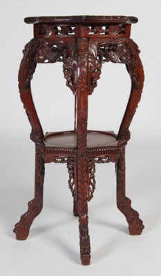 Lot 70 - An unusual Chinese darkwood urn stand, late...