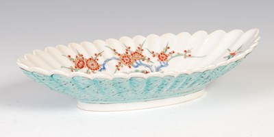 Lot 567 - An antique Japanese Kakiemon fluted oval dish,...