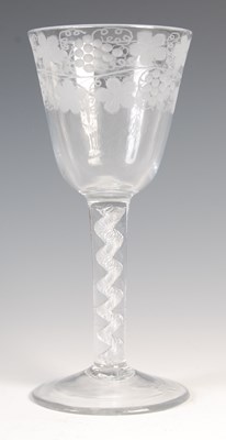 Lot 470 - A large antique air-twist wine glass, the ogee...