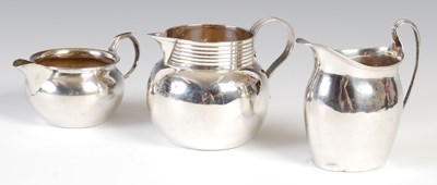 Lot 340 - A George V silver cream jug, Edinburgh, 1924,...