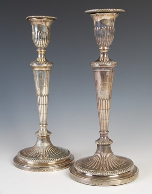 Lot 357 - A pair of George III silver candlesticks,...