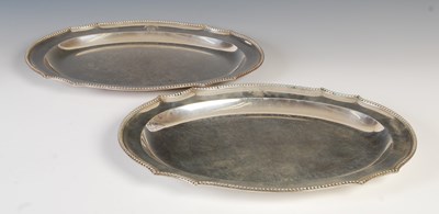 Lot 381 - A pair of George III silver platters, London,...