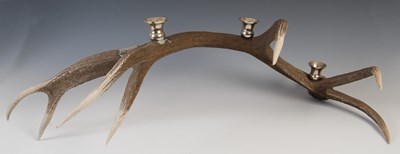 Lot 183 - A decorative stag horn candle stand, set with...