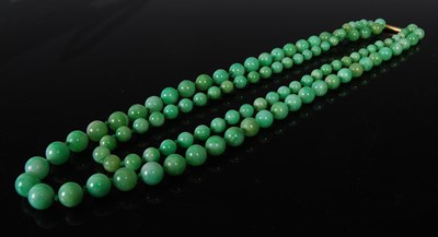 Lot 410 - A jade bead double strand graduated necklace,...