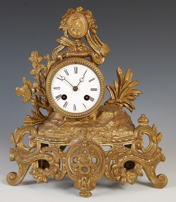 Lot 197 - A late 19th century gilt metal mantle clock,...