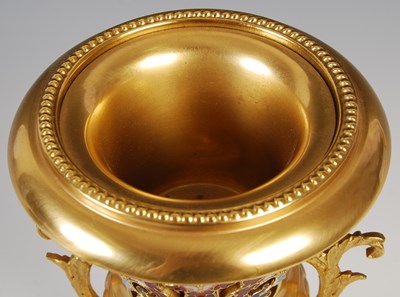 Lot 198 - A late 19th century gilt metal and champleve...