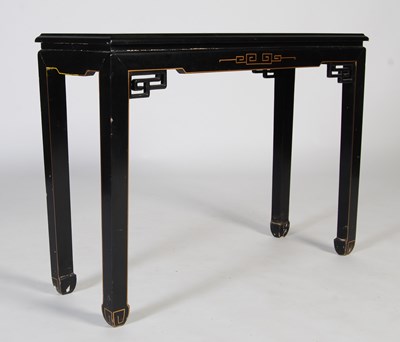 Lot 104 - A black lacquer console table in the Chinese...