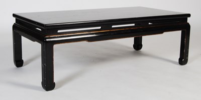 Lot 49 - A black and gilt lacquer coffee table in the...