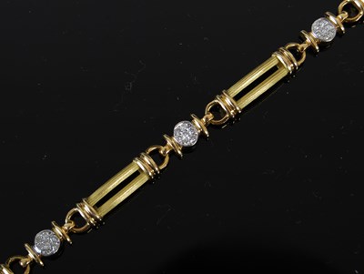 Lot 456 - An 18ct gold and diamond set rectangular link...