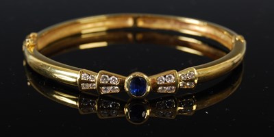 Lot 457 - A yellow metal sapphire and diamond set hinged...