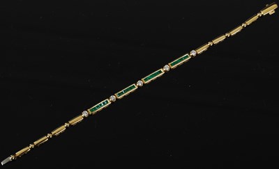 Lot 450 - An 18ct gold, emerald and diamond link...