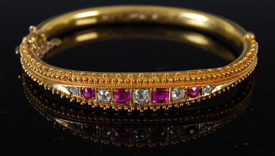 Lot 451 - A late Victorian yellow metal garnet topped...