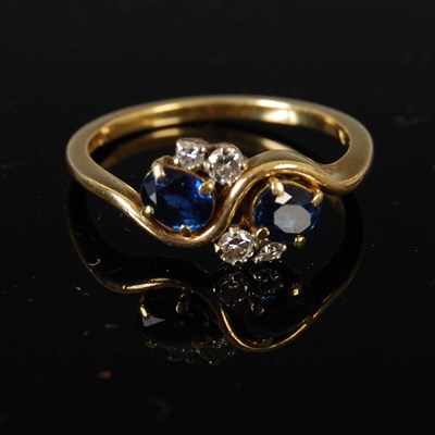 Lot 433 - An 18ct gold sapphire and diamond twist ring,...