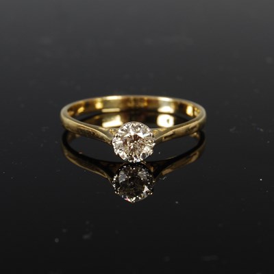 Lot 440 - An 18ct gold and diamond solitaire ring, the...