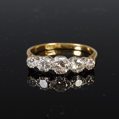 Lot 441 - A yellow and white metal five stone diamond...