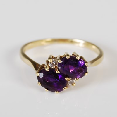 Lot 422 - An 18ct gold amethyst and diamond ring, set...