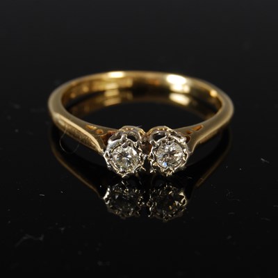 Lot 416 - A yellow metal two stone diamond ring, with...