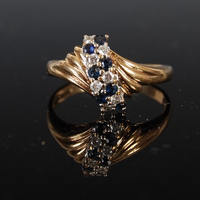 Lot 418 - A 9ct gold sapphire and diamond ring, set with...