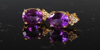 Lot 415 - A pair of 18ct gold amethyst and diamond stud...