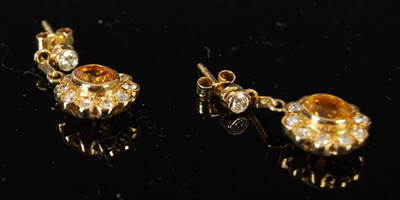 Lot 439 - A pair of 18ct gold yellow sapphire and...