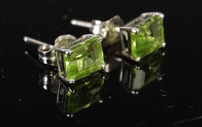 Lot 389 - A pair of 18ct white gold and peridot stud...