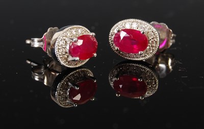 Lot 403 - A pair of 18ct white gold ruby and diamond...