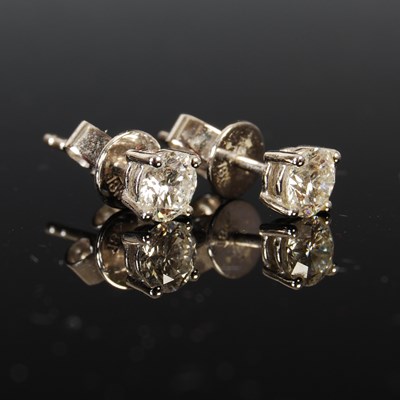 Lot 448 - A pair of 18ct white gold and diamond stud...