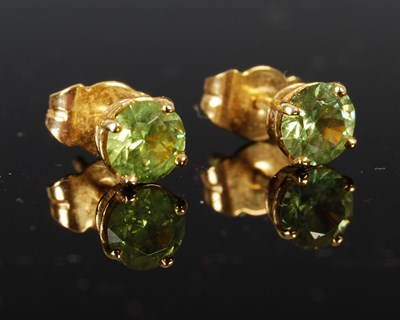 Lot 405 - A pair of 18ct gold and demantoid garnet stud...