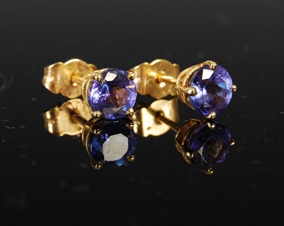 Lot 411 - A pair of 18ct gold and tanzanite stud...