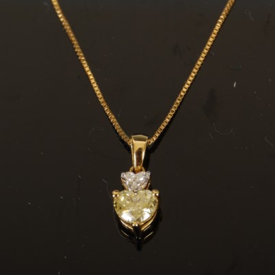 Lot 427 - An 18ct gold yellow and white diamond two...