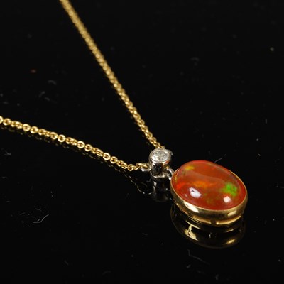 Lot 413 - A yellow metal mounted fire opal and diamond...