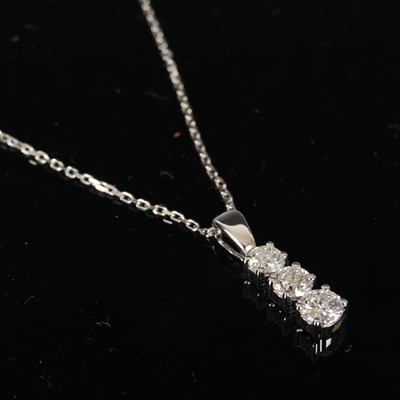 Lot 443 - An 18ct white gold and diamond pendant...