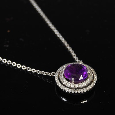 Lot 429 - An 18ct white gold, amethyst and diamond...