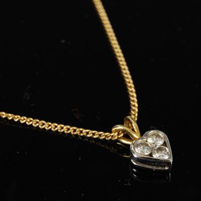 Lot 423 - An 18ct yellow and white gold three stone...