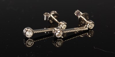 Lot 425 - A pair of 18ct white gold and diamond drop...