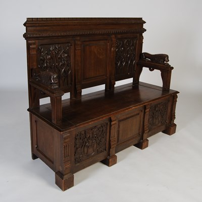 Lot 19 - A late 19th/ early 20th century oak settle,...