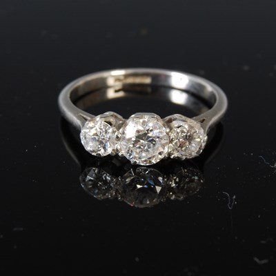 Lot 382E - A white metal three stone diamond ring,...