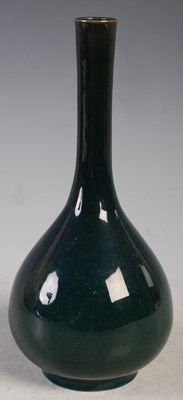 Lot 4 - A green ground porcelain bottle vase, 20 cm high.