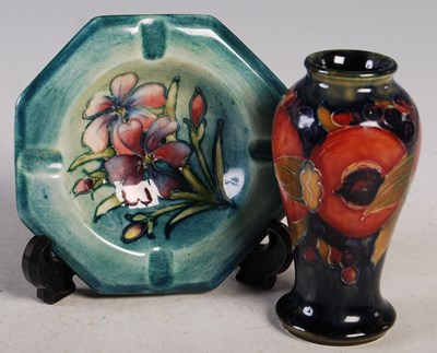 Lot 32 - A miniature Moorcroft Pottery vase decorated...