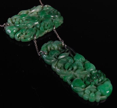 Lot 37 - An early 20th century jade pendant suspended...