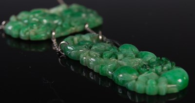 Lot 37 - An early 20th century jade pendant suspended...