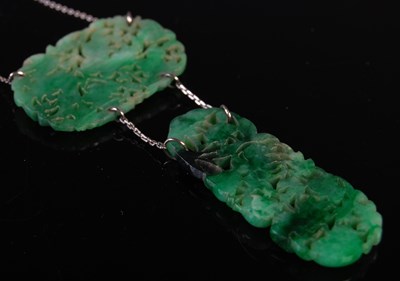 Lot 37 - An early 20th century jade pendant suspended...