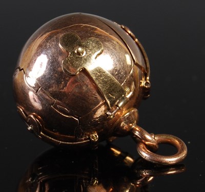 Lot 42 - A yellow metal Masonic orb-shaped metamorphic...